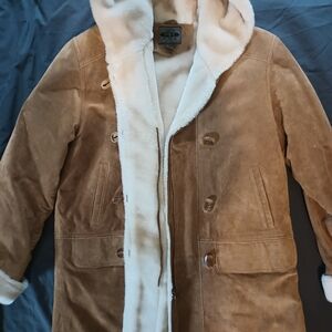 A leather coat in a tan/camel color.  Size large.  A. Bernardo brand.